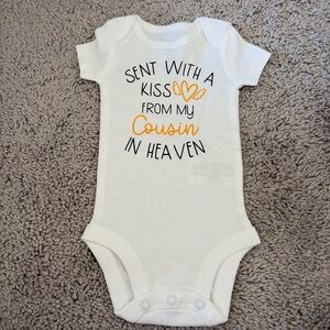 NWOT Carter’s customized “Sent with a kiss from my cousin in heaven” NB onesie